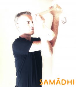 Greg demonstrates Garudasana with a belt, for tighter shoulders